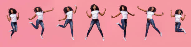 collage di ragazza nera riccia saltante su rosa - women action jumping running foto e immagini stock