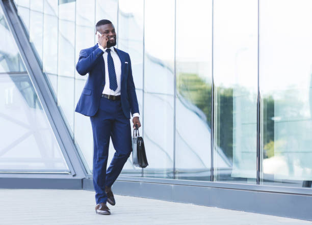 istock Businessman Talking On Cellphone Going To Work In Urban Area 1172745596