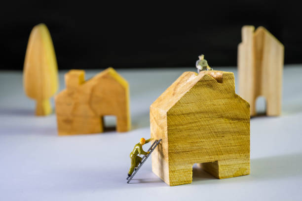 istock Small figure worker and House model. House building concept 1172745749