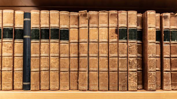 istock Antique books on wooden bookshelf in library 1172746270