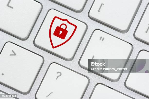 Cyber Crime And Cyber Security Concept Red Shield And A Pad Lock On Computer Keyboard Button Depicts Protection And Prevent Cyber Attack From Attacker Or A Hacker Who Attempt To Access On A System Stock Photo - Download Image Now