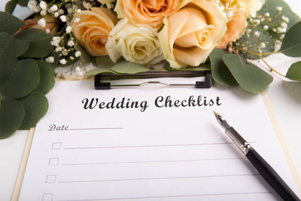 istock Wedding checklist is ready to be full of items on white sheet 1172746494