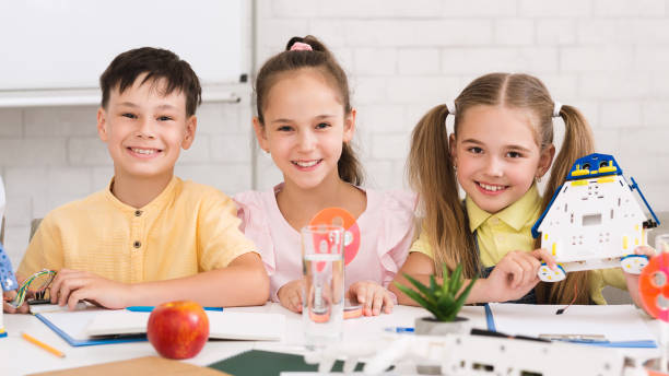 istock Stem education. Children building robots in classroom 1172746791