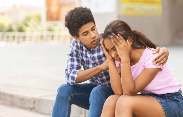 istock Young guy comforting his sad girlfriend after arguing 1172747658