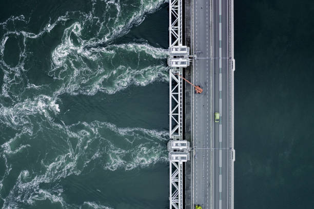 istock Storm Surge Dam Venting Water During High Tide 1172747681