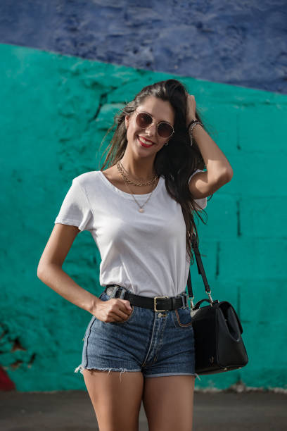 istock Happy young female standing outdoors and smiling 1172756908