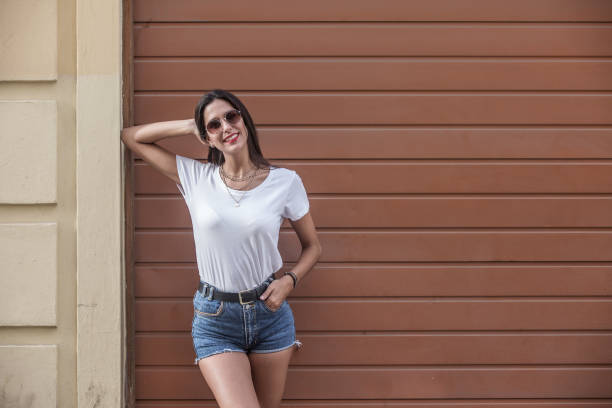 istock Trendy brunette standing on street 1172756956
