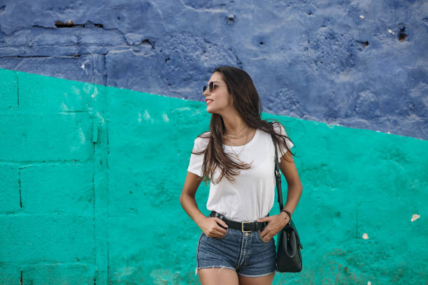 istock Trendy female standing with hands in pockets 1172756958