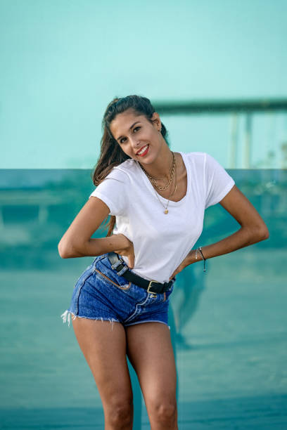 istock Smiling female with hands on waist 1172757206