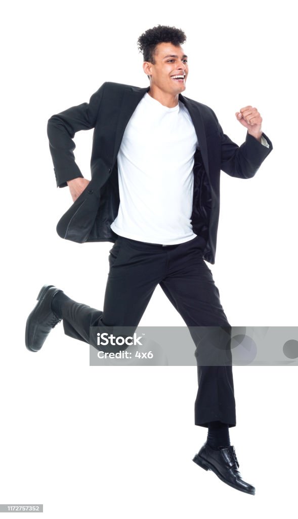 Full Length Front View Of 2029 Years Old Adult Handsome People Tall Person  Curly Hair African Ethnicity Africanamerican Ethnicity Male Young Men  Businessman Business Person Running Exercising Jumping In Front Of White