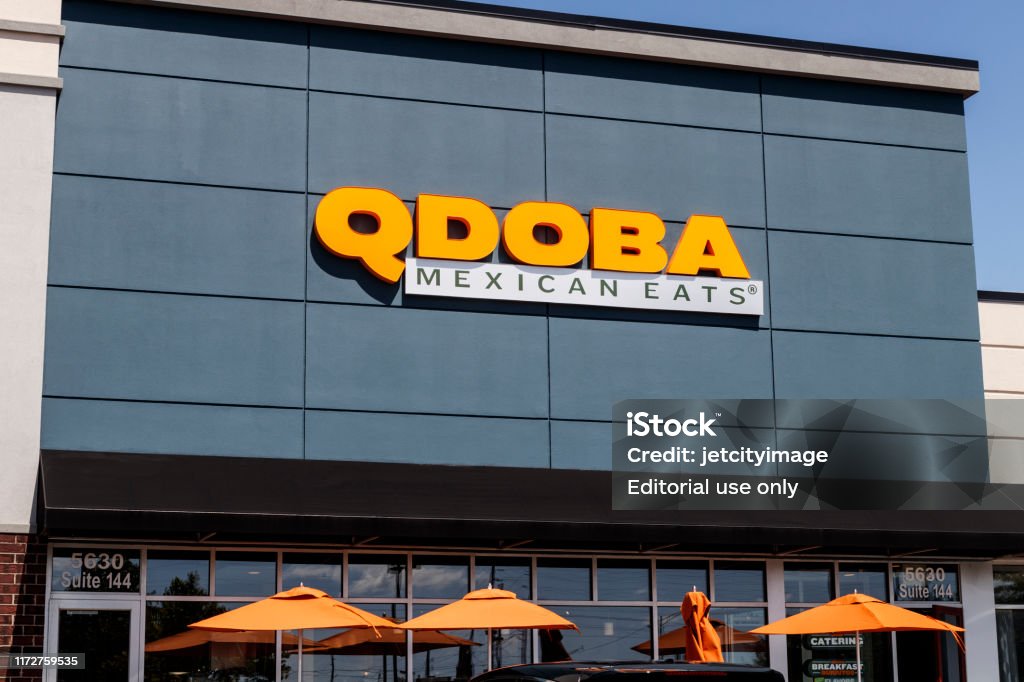 Qdoba Mexican Grill Fast Casual Restaurant. Qdoba was purchased by Apollo Global Management in 2018 II Indianapolis - Circa August 2019: Qdoba Mexican Grill Fast Casual Restaurant. Qdoba was purchased by Apollo Global Management in 2018 II Breakfast Stock Photo