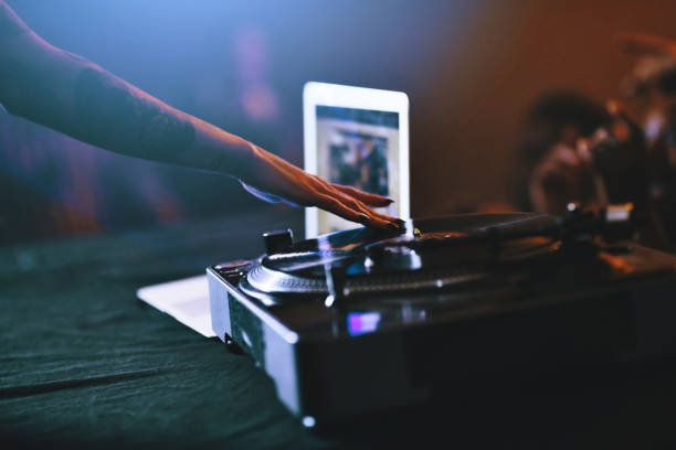 I know just what song to play Cropped shot of an unrecognizable female dj mixing music on a turntable in a nightclub dubstep photos stock pictures, royalty-free photos & images