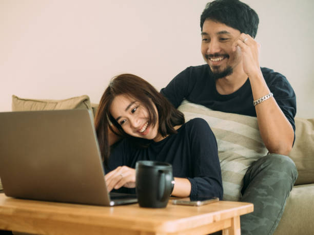 istock Young couple working at home with laptop. 1172761651