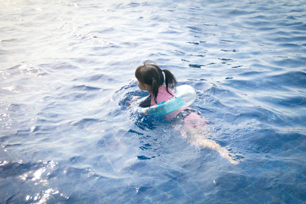 Little girl in swimming pool