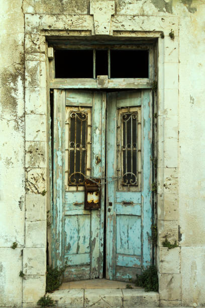 istock Front door of an old abandoned house 1172763022