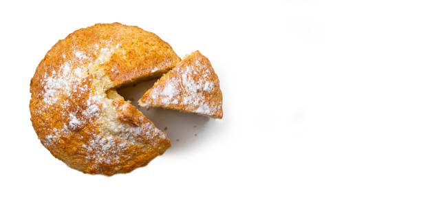 istock Freshly baked cupcake banner with a cut piece on a white background. Bakery products. 1172765967