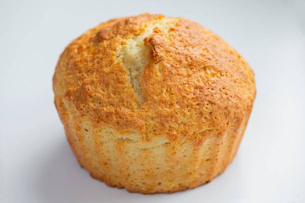 Freshly baked cupcake close-up on a light background. Bakery products.