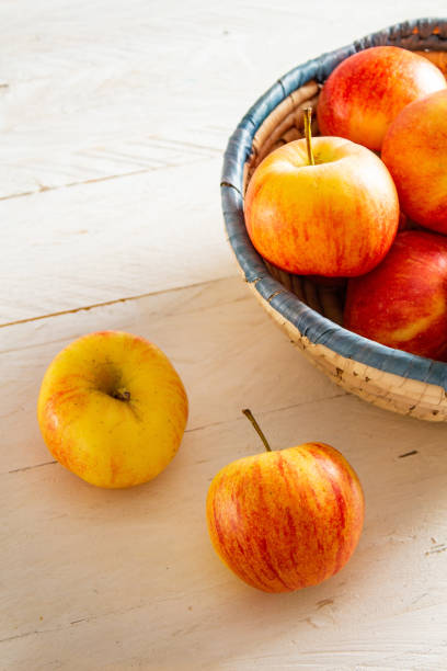 istock Delicious Apples on a Rustic Wooden Background 1172766460