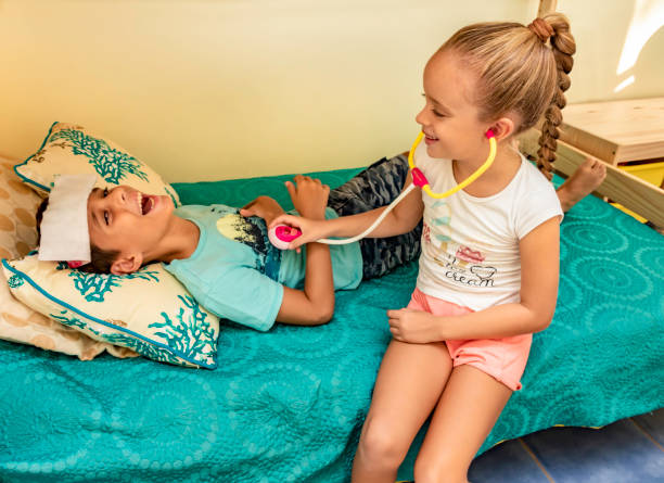 istock A boy and a girl playing doctor 1172767506