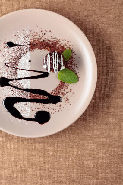istock Chocolate ball with mint on a beige plate. 1172767907