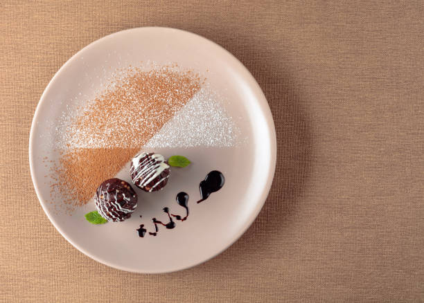 istock Chocolate balls with mint on a beige plate. 1172767915