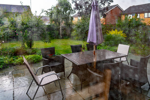 istock Back garden viewed through a patio door on a rainy day 1172768046