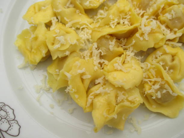 istock Ravioli stuffed with raw ham and sprinkled with Parmesan cheese 1172769519