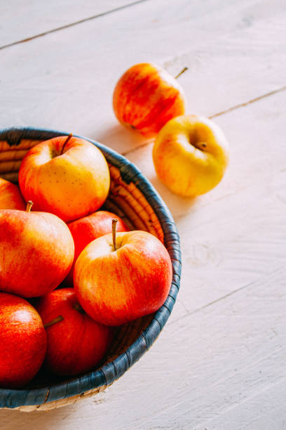 istock Delicious Apples on a Rustic Wooden Background 1172770361