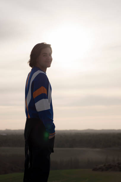istock YOUNG MAN WITH STRIPED JERSEY 1172773304
