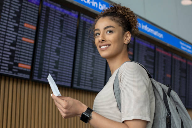 istock Woman traveler at flight information 1172773488