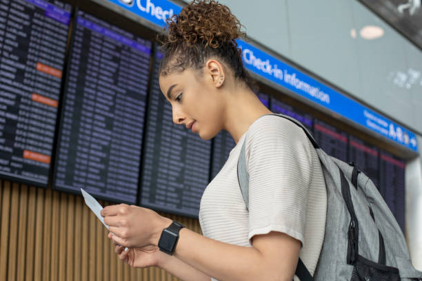 istock Woman traveler at flight information 1172773580