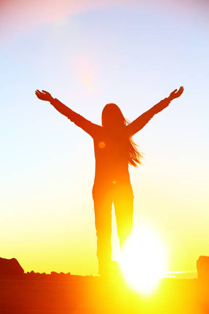 istock Happy cheering celebrating success woman sunset 1172774497