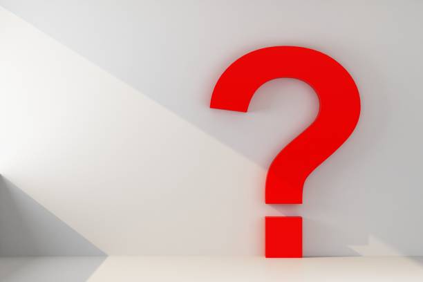 istock question mark on a wall with ray of light 1172774662