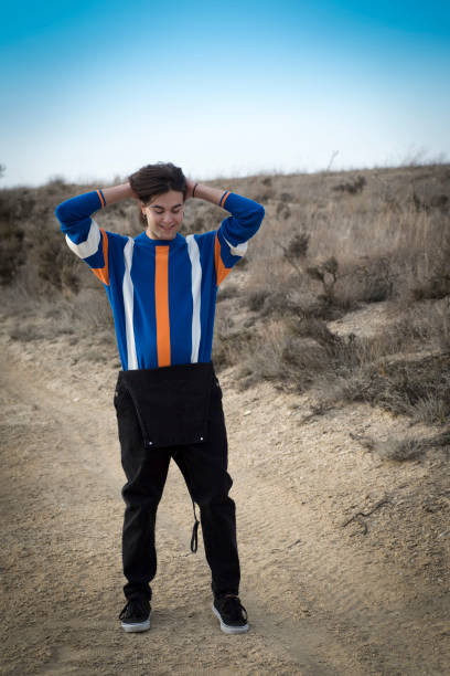 istock YOUNG MAN WITH STRIPED JERSEY 1172775213
