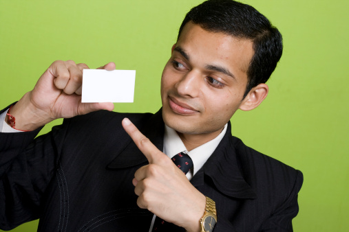 Young Indian Businessman showing a Blank business card