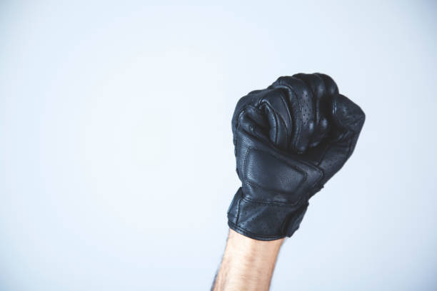 istock man fist  black gloves 1172784501