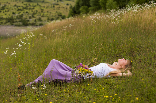 Woman  enjoys resting in the beautiful nature.