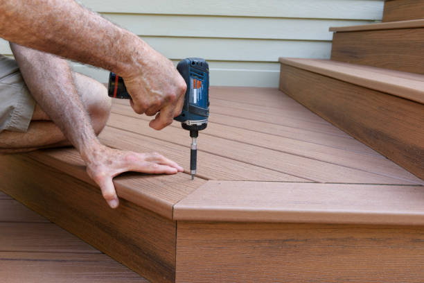 worker installing composite wood decking - holzterrasse stock-fotos und bilder