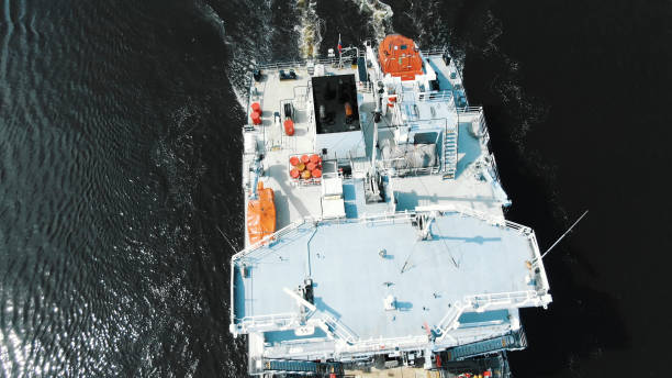 istock modern white freight vessel with empty brown wooden deck 1172791490