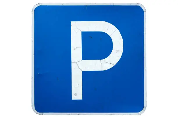 'Parking' road sign with cracks isolated on white.