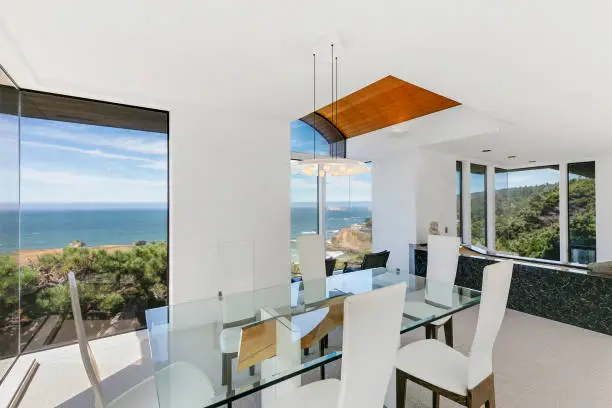 Photo of Modern dining area in California, oceanfront Home. Stock Photo