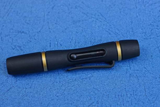 istock black long cleaning pencil lies on a blue table 1172793517