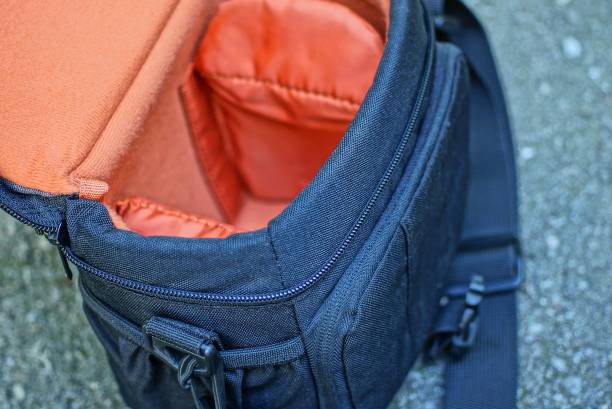 istock black red camera bag lies on gray asphalt 1172793873