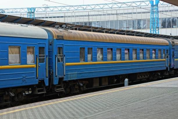 istock blue passenger car stands at the railway station 1172795079