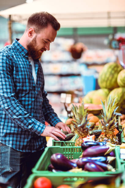 istock Male Choosing Fruit In Supermarket 1172796559