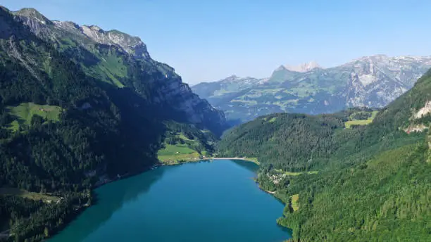Aerial view of Klöntalersee lake valley in mountains, Kanton Glarus, Switzerland. Swiss nature.