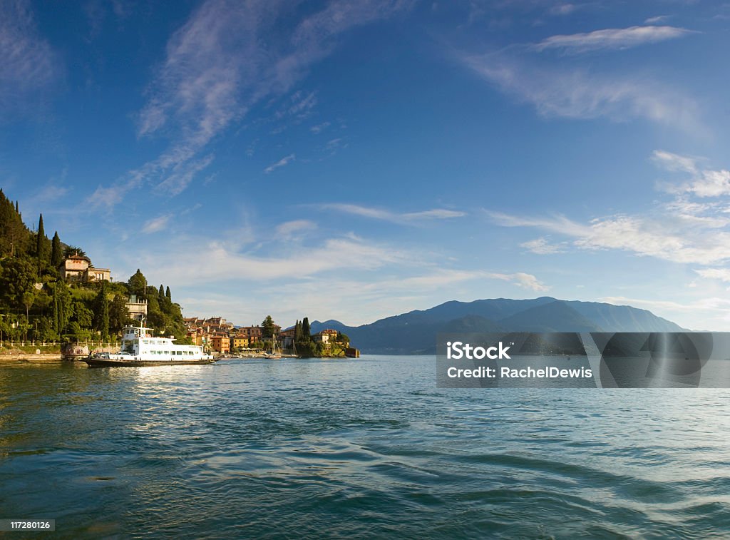 Italian Lake District. The pretty lakeside town of Bellagio on Lake Como.  This picturesque town is overlooked by magnificent mountains and lapped by clear blue waters.  Stitched panorama.  Pro Photo RGB. Bellagio Stock Photo