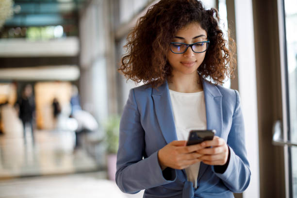 istock Young businesswoman using mobile phone 1172801954