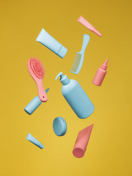 produtos cosméticos na cor azul e cor-de-rosa no fundo amarelo - esmalte cosmético - fotografias e filmes do acervo