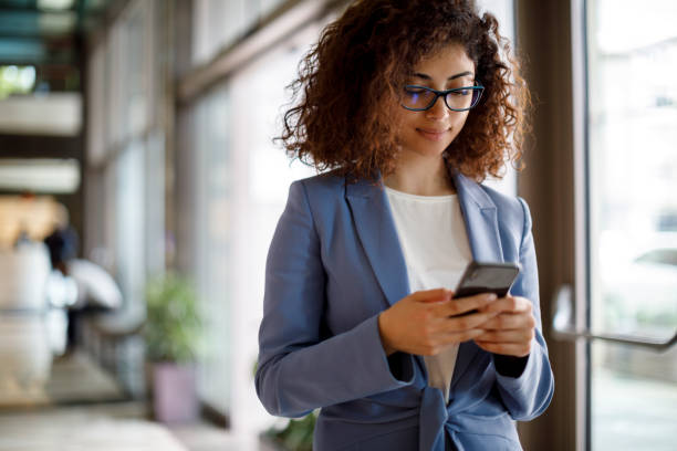istock Young businesswoman using mobile phone 1172803136